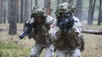 Как военные учения НАТО в Латвии связаны с миграционным кризисом