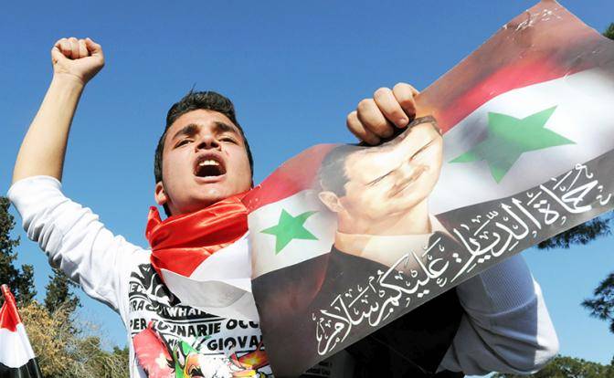 Асад отмечает триумфальную победу